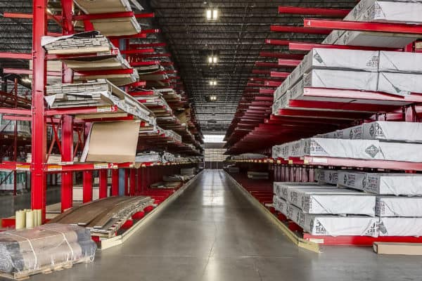 Red shelving and materials inside Riverhead Supply Building